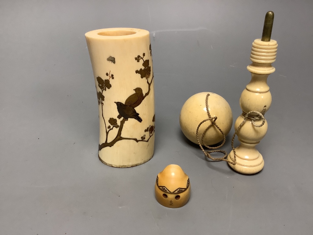 A Japanese gilt lacquered ivory vase, 11.2cm high, a 19th century ivory cup and ball game and an ivory netsuke of Daruma